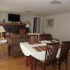 The living room and dining room with a picture window of the river. The brand new sofa bed forms a Queen bed.